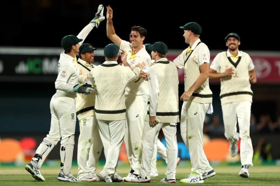 Pat Cummins of Australia celebrates with teammates in the fifth Test in Hobart (Getty)