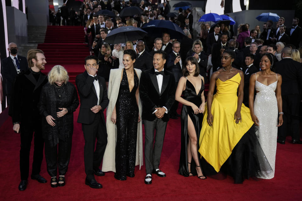 Finneas O'Connell, from left, Billie Eilish, Rami Malek, Phoebe Waller-Bridge, Cary Joji Fukunaga, Ana de Armas, Lashana Lynch and Naomie Harris pose for photographers upon arrival for the World premiere of the new film from the James Bond franchise 'No Time To Die', in London Tuesday, Sept. 28, 2021. (AP Photo/Matt Dunham)