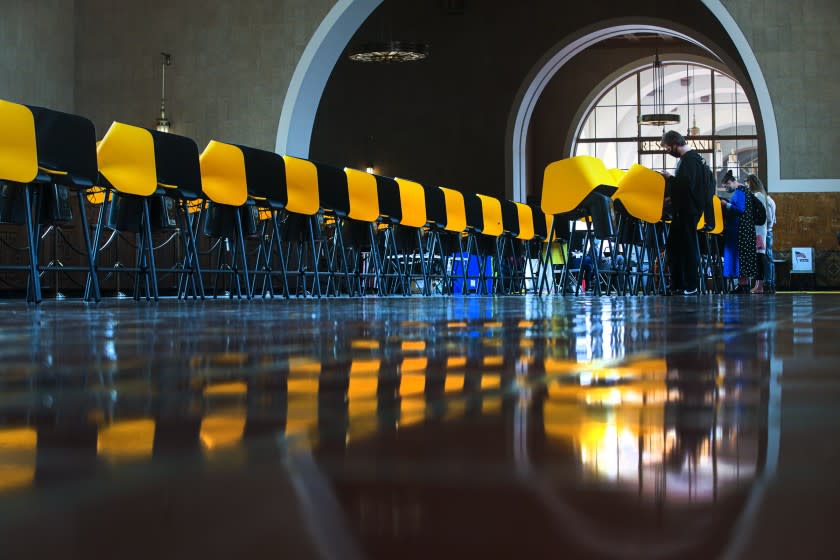 LOS ANGELES, CA - NOVEMBER 03: People voting at a polling station located at Union Station on Tuesday, Nov. 3, 2020 in Los Angeles, CA. (Irfan Khan / Los Angeles Times)