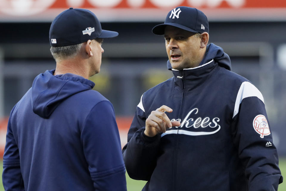 New York Yankees manager Aaron Boone, right, talks with Houston Astros manager AJ Hinch during batting practice before Game 5 of baseball's American League Championship Series Friday, Oct. 18, 2019, in New York. (AP Photo/Matt Slocum)