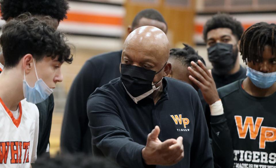 White Plains' head coach Spencer Mayfield talks to his team during a 69-48 win over Port Chester at White Plains Jan. 6, 2022. It was his 400th win at White Plains and 465th win overall.