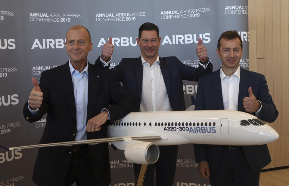 Airbus CEO Tom Enders, left, CFO Harald Wilhelm and president of Airbus Commercial Aricraft Guillaume Faury, thumb up before the presentation of Airbus 2018 results in Toulouse, southern France, Thursday, Feb.14, 2019. The European plane manufacturer Airbus said Thursday it will stop making its superjumbo A380 in 2021 for lack of customers, abandoning the world's biggest passenger jet and one of the aviation industry's most ambitious and most troubled endeavors. (AP Photo/Fred Scheiber)