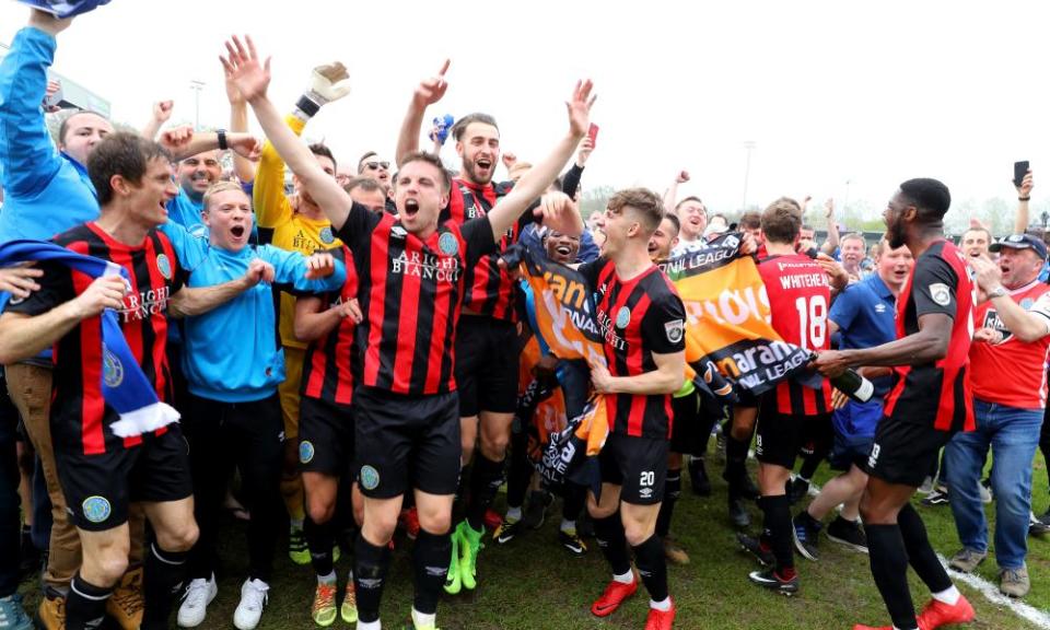 Macclesfield Town players celebrate after gaining promotion at Eastleigh.