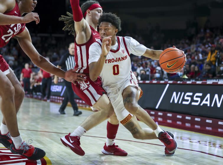 Los Angeles, CA - February 20: USC guard Boogie Ellis, #0, right, who had 21 points in the game.