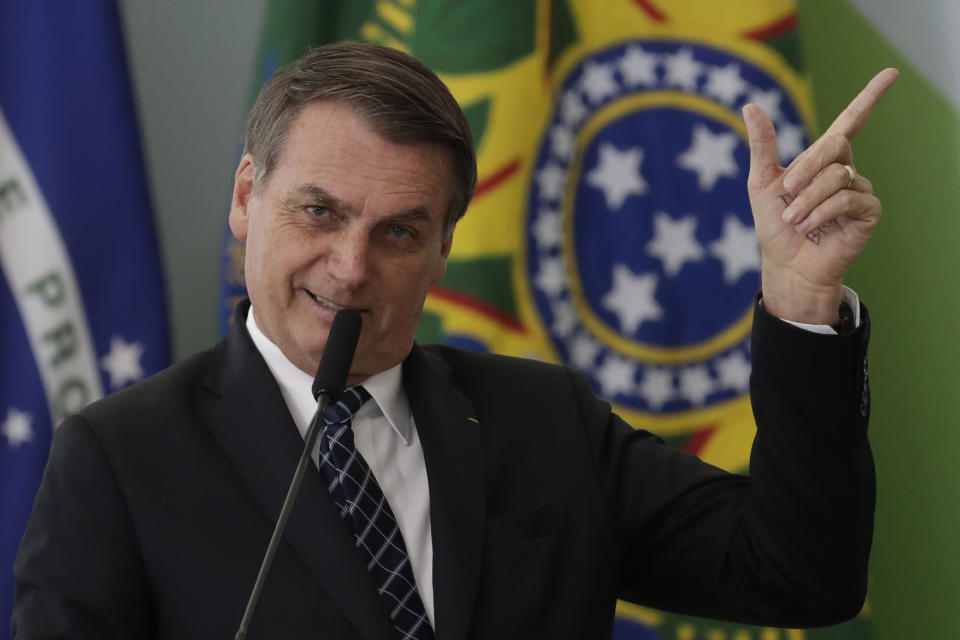 Brazil's President Jair Bolsonaro speaks during the launching ceremony of the Doctors for Brazil Program, at the Planalto Presidential Palace, in Brasilia, Brazil, Thursday, Aug. 1, 2019. According to the government, the Doctors for Brazil Program will replace the program implemented by Former President Dilma Rousseff with the help of Cuban doctors, replacing them with Brazilian doctors. (AP Photo/Eraldo Peres)