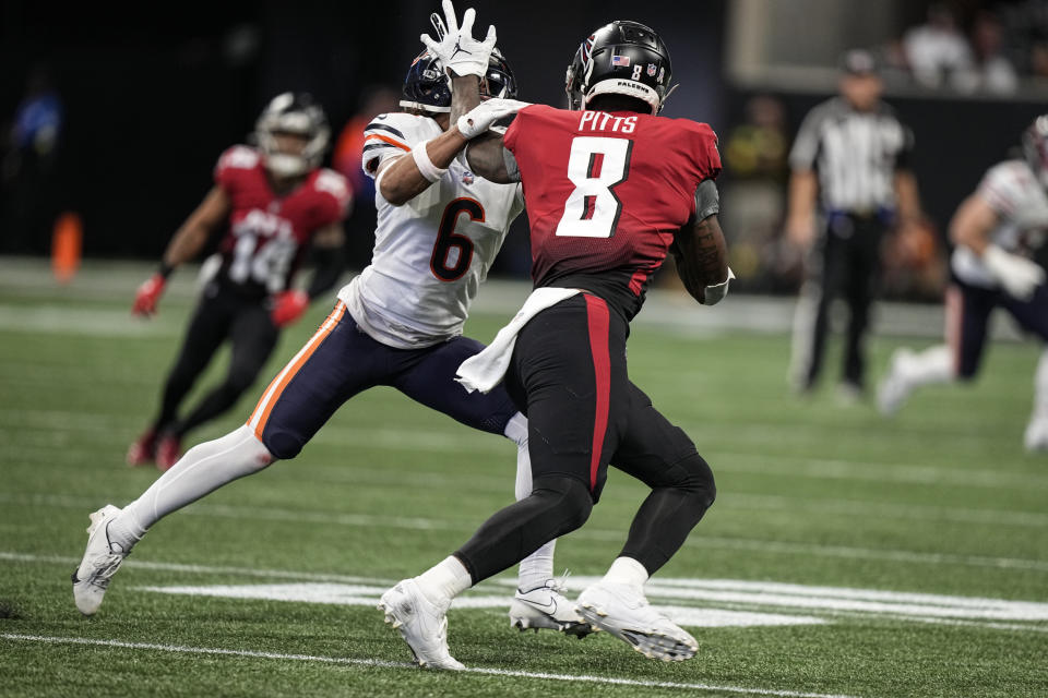 Atlanta Falcons tight end Kyle Pitts (8) runs against Chicago Bears cornerback Kyler Gordon (6) during the first half of an NFL football game, Sunday, Nov. 20, 2022, in Atlanta. (AP Photo/Brynn Anderson)