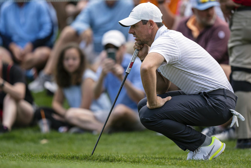 Rory McIlroy lines up his putt on the first hole during the third round of the Wells Fargo Championship golf tournament at Quail Hollow on Saturday, May 8, 2021, in Charlotte, N.C. (AP Photo/Jacob Kupferman)