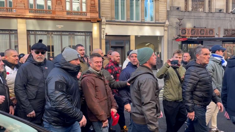 Tommy Robinson with counter protesters in London’s Chinatown on Remembrance weekend (PA)