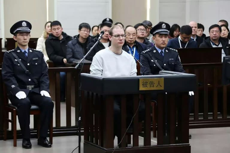 Canadian Robert Lloyd Schellenberg (C) is pictured during the retrial at which he was sentenced to death for drug trafficking