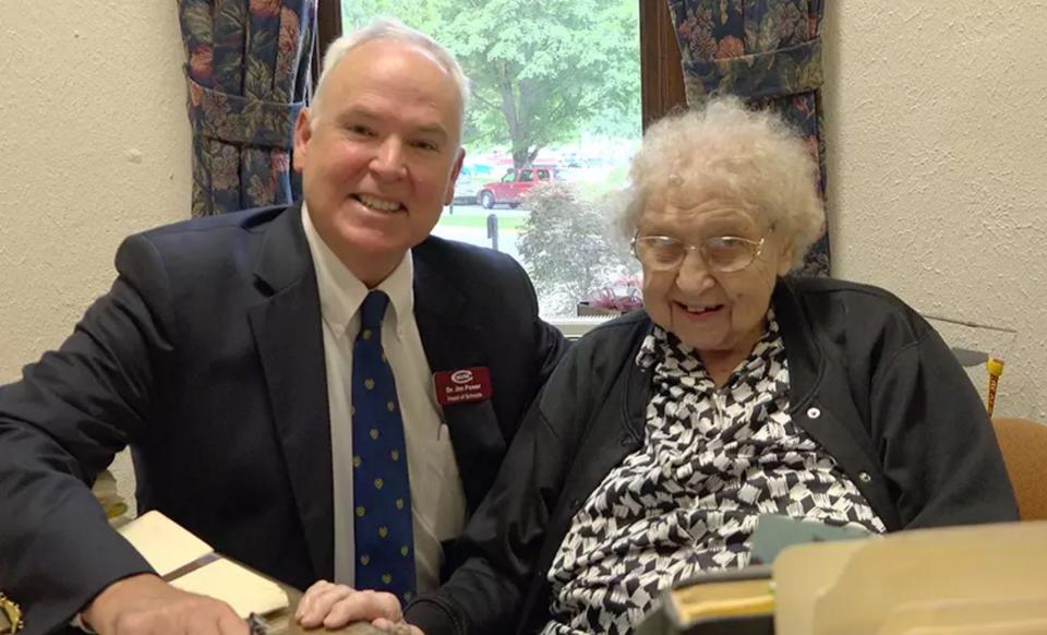 Elisabeth Davis, 99, has been working at Culver Academies in Culver, Indiana, since 1936. She is secretary&nbsp;in the head of schools office,&nbsp;maintaining more than a&nbsp;century's worth of documents and records for the&nbsp;college preparatory boarding school located on Lake Maxinkuckee. She's shown here with Head of Schools Jim Power.