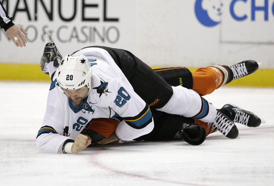 San Jose Sharks&#39; John Scott, top, fights with Anaheim Ducks&#39; Tim Jackman during the first period of an NHL hockey game Sunday, Oct. 26, 2014, in Anaheim, Calif. (AP Photo/Jae C. Hong)