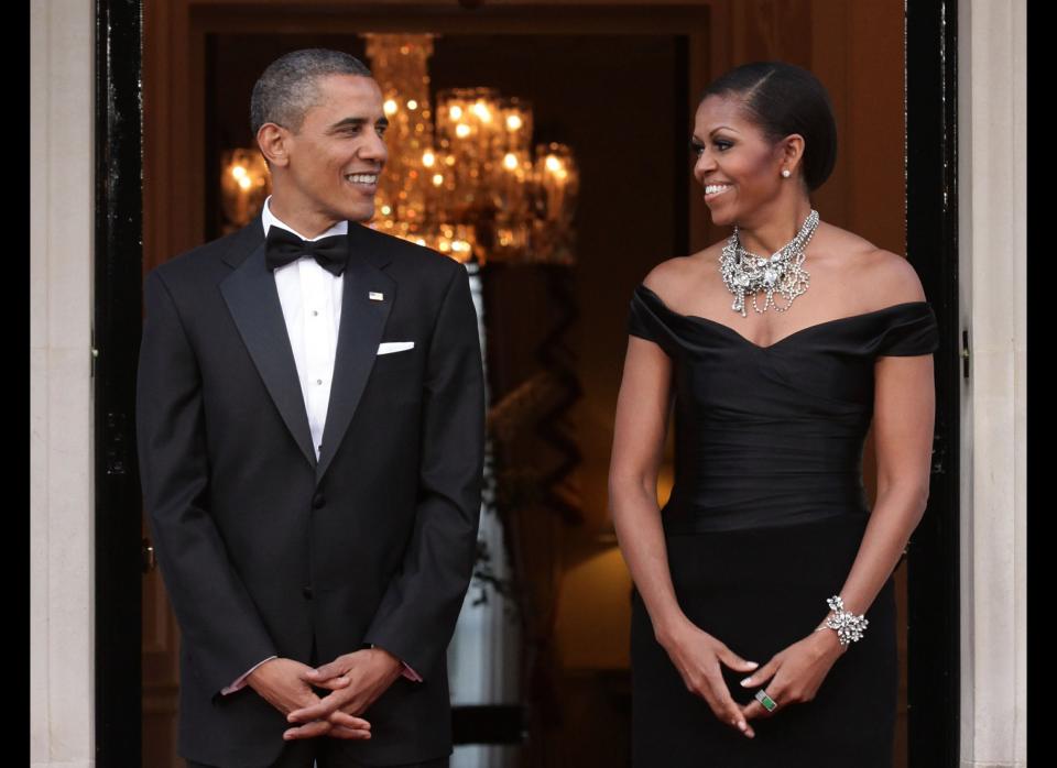 LONDON, ENGLAND - MAY 25:  U.S. President Barack Obama and First Lady Michelle Obama arrive at Winfield House, the residence of the Ambassador of the United States of America, in Regent's Park, on May 25, 2011 in London, England. The 44th President of the United States, Barack Obama, and First Lady Michelle are in the UK for a two day State Visit at the invitation of HM Queen Elizabeth II. Last night they attended a state banquet at Buckingham Palace and today's events include talks at Downing Street and the President will address both houses of Parliament at Westminster Hall.  (Photo by Yui Mok - WPA Pool/Getty Images)