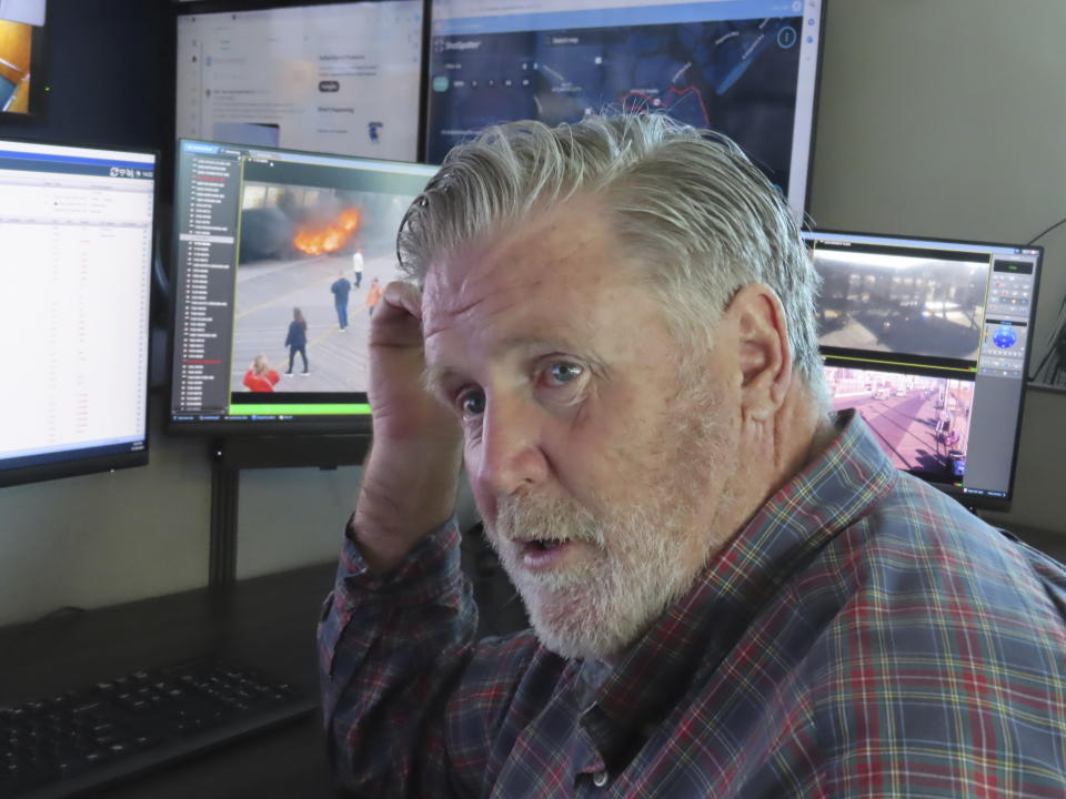 Bill McMenamin, a retired Atlantic City, N.J. police captain, monitors video screens in the department's surveillance center, where he currently works, on Nov. 16, 2023. The city is adding hundreds of security cameras to the 3,000 already keeping an eye on it. (AP Photo/Wayne Parry)