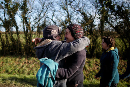 Residents of the zoned ZAD (Deferred Development Zone) react after the French government's official announcement to abandon the Grand Ouest Airport (AGO) project in Notre-Dame-des-Landes, near Nantes, France, January 17, 2018. REUTERS/Stephane Mahe