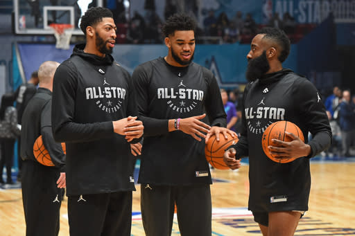 Anthony Davis (left) chats with Karl-Anthony Towns (middle) and James Harden during practice Saturday at Charlotte, North Carolina. (Photo by Andrew D. Bernstein/NBAE via Getty Images)