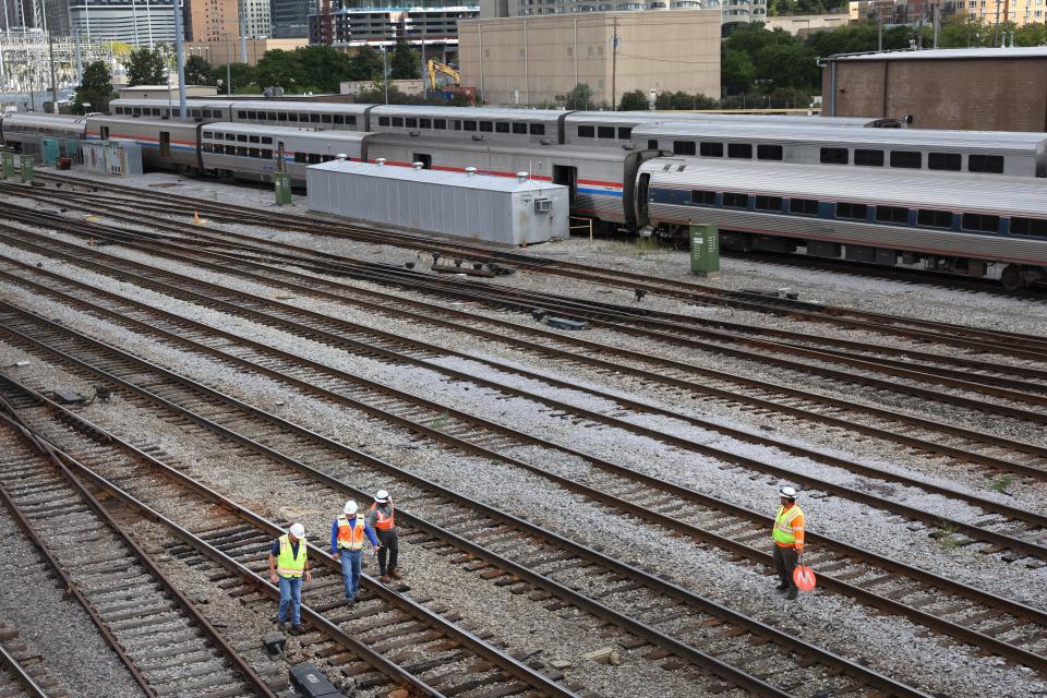 Workers service the tracks at the Metra/BNSF railroad yard outside of downtown on September 13, 2022 in Chicago, Illinois.