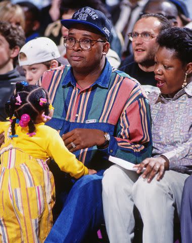 <p>Nathaniel S. Butler/NBAE/Getty</p> Phillip Harrison sits courtside during a game played circa 1993 at the Orlando Arena in Orlando, Florida.