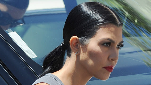 It's safe to say Kourtney Kardashian hasn't had the most relaxing month, and it appears the stress might be catching up with her. Following her recent split from her longtime boyfriend, Scott Disick, after nine years together, the 36-year-old mother-of-three was spotted out and about in Los Angeles on Tuesday with some noticeably gray hair standing out from her jet black tresses. Daniel Robertson/startraksphoto.com <strong>WATCH: Kris Jenner Says Kourtney Kardashian Is 'Hanging in There' After Scott Disick Split</strong> Kourtney has been sticking to her sisters Kim Kardashian and Khloe Kardashian since the split, and the three of them were snapped at Hugo's restaurant in Los Angeles on Tuesday, filming for <em>Keeping Up With the Kardashian</em>s. While Kourtney went casual in a muscle tank featuring the band The Police and ripped jeans, Kim was edgy as usual in a floor-length grey ensemble, while Khloe showed off her newly slimmed-down bod in super-short shorts and a skin-tight black top. Splash News Aside from leaning on her siblings, Kourtney has been going hard at the gym with Khloe, recently sharing this snap of the two working out. "We almost threw up," she wrote. Meanwhile, Scott showed his face for the first time on Tuesday since news of the split broke, promoting Fit Tea on Instagram. "Gotta be fresh to stay on the grind," he wrote. The 32-year-old reality star has stayed mum on the split, which happened after he was pictured getting touchy-feely with his ex, celebrity stylist Chloe Bartoli, in Monte Carlo earlier this month. He did, however, wish his 3-year-old daughter, Penelope, a somber happy birthday last week through Instagram. Penelope spent the day at Disneyland with Kourtney, Kim, and her cousin, 2-year-old North West. "1 of the only things I'm proud off about myself," he wrote. "Happybdayp." <strong>WATCH: Scott Disick's Ex, Chloe Bartoli, Gets Attacked on Social Media</strong> Watch below:
