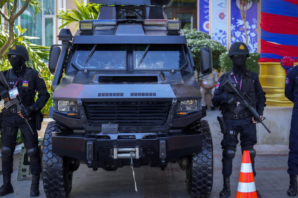 Security personnel stand guard at the ASEAN summit venue in Phnom Penh, Cambodia, Wednesday, Nov. 9, 2022. Southeast Asian leaders convene in the Cambodian capital Thursday, faced with the challenge of trying to curtail escalating violence in Myanmar while the country's military-led government shows no signs of complying with the group's peace plan. (AP Photo/Anupam Nath)