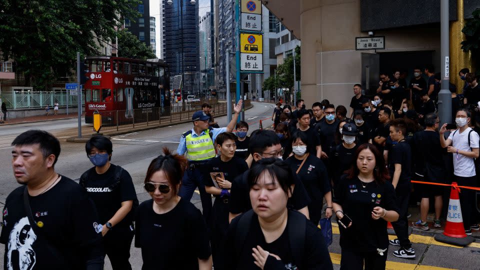 Fans leave the funeral of  singer and songwriter CoCo Lee, in Hong Kong. - Tyrone Siu/Reuters