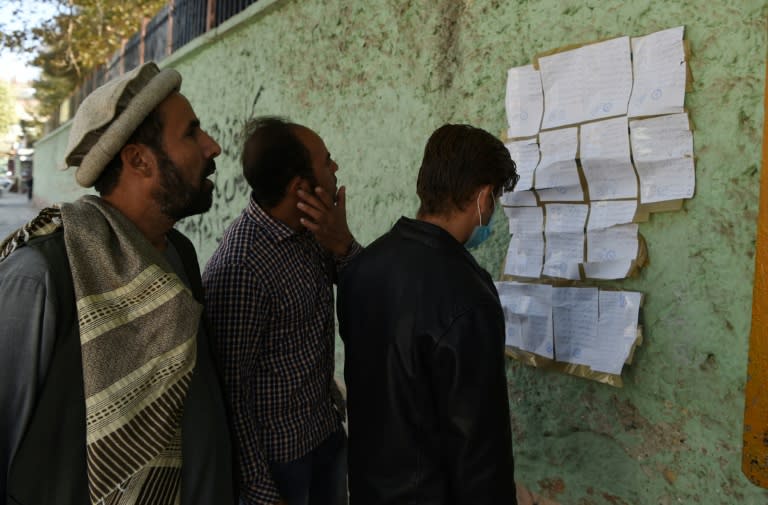 Afghan election observers check voting results, as officials vowed to investigate the mishandling of the weekend's problem-plagued legislative ballot