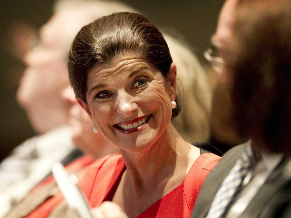 Luci Baines Johnson smiles and looks off to the side