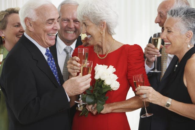 Senior friends drinking champagne at party