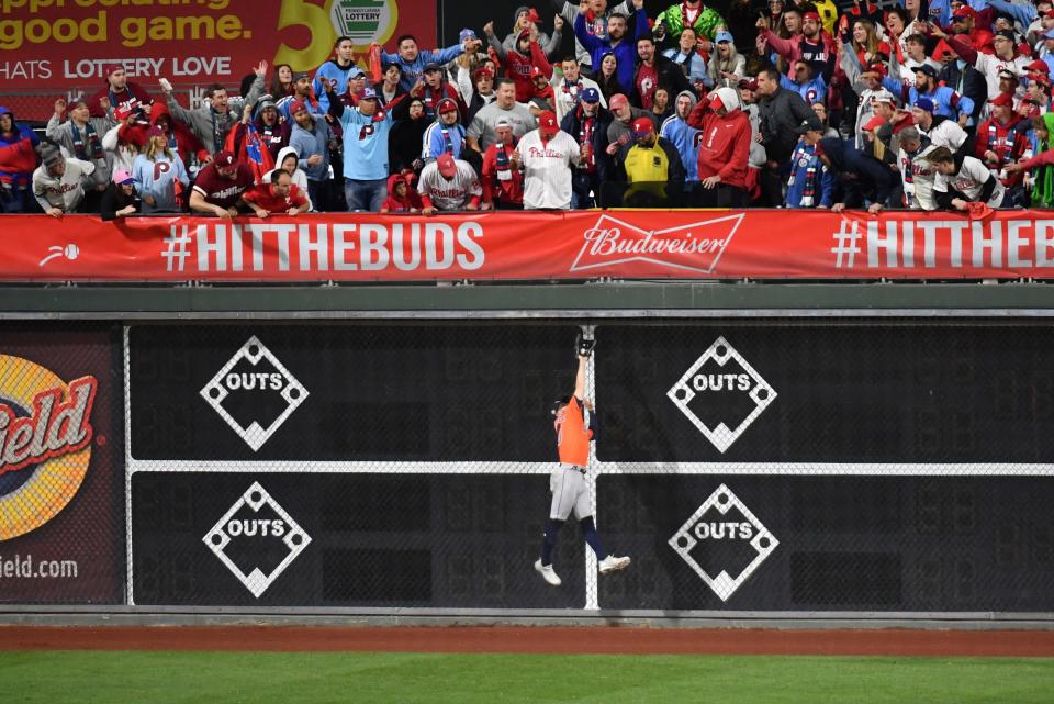 Game 5: Astros center fielder Chas McCormick makes an amazing catch at the wall in the ninth inning,