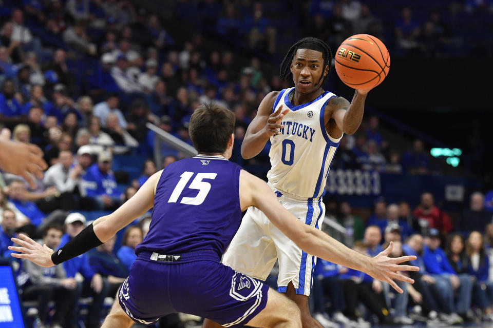 Kentucky guard Rob Dillingham (0) passes the ball away from Stonehill forward Louie Semona (15) during the second half of an NCAA college basketball game in Lexington, Ky., Friday, Nov. 17, 2023. (AP Photo/Timothy D. Easley)