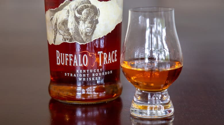 Close-up of a glass of Buffalo Trace whiskey and bottle
