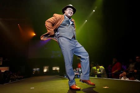 A model poses on the runway during Tokyo Pocchari collection, Japan's first fashion show for the plump men in Tokyo. REUTERS/Kim Kyung-Hoon