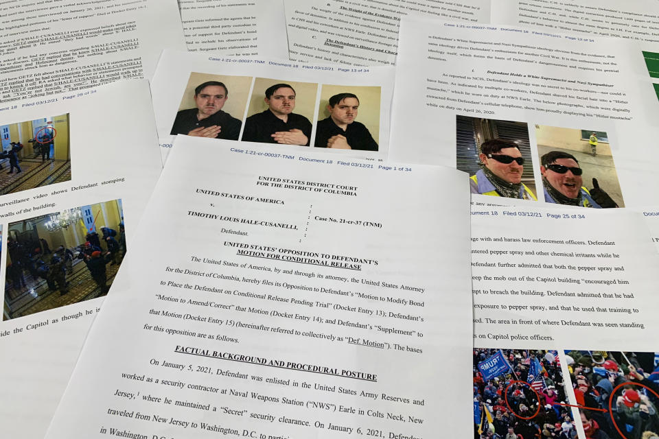 The Department of Justice motion to oppose the conditional release of Timothy Hale-Cusanelli ahead of his trial on charges stemming from the Jan. 6, 2021, riot at the U.S. Capitol, is photographed on Tuesday, May 24, 2022. Hale-Cusanelli was arrested less than two weeks after the attack and has remained jailed since February 2021. His trial began in federal court in Washington on May 24. (AP Photo/Jon Elswick)