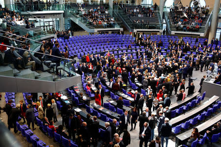 Members of parliament vote during a session of German lower house of Parliament, Bundestag, in Berlin, Germany, February 1, 2018. REUTERS/Axel Schmidt