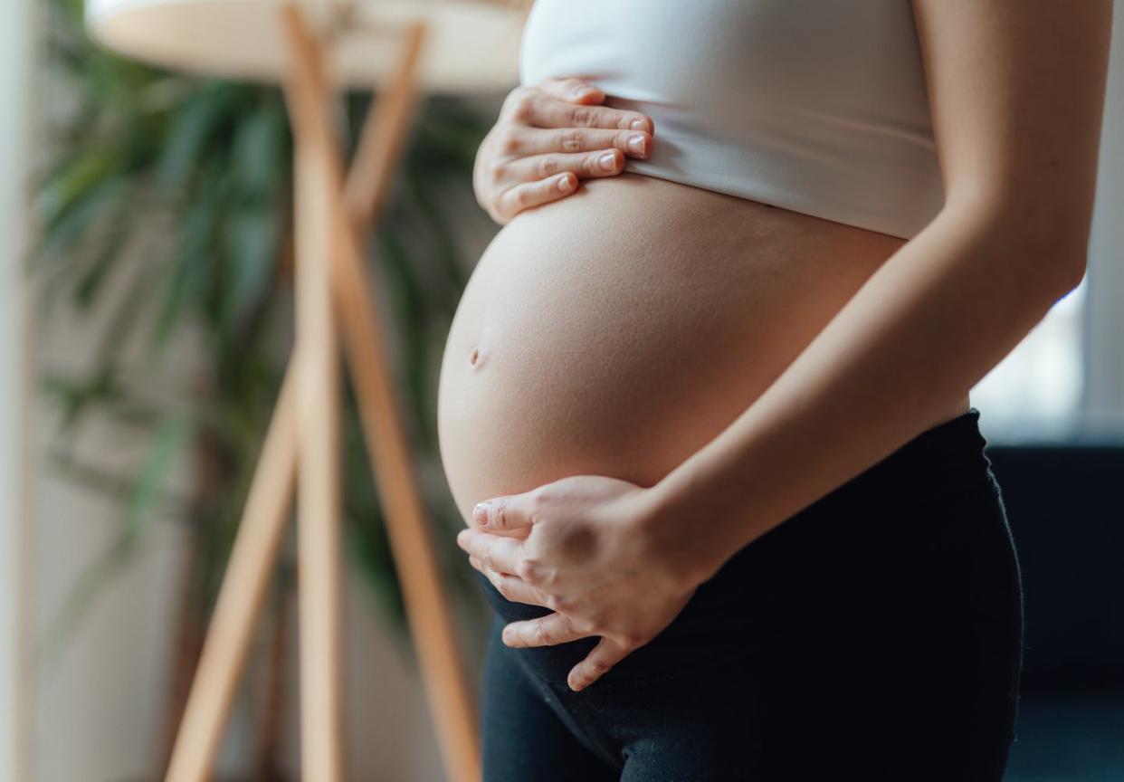 <span class="caption">Nearly 100 scholars and health care professionals are urging women to limit their use of acetaminophen during pregnancy. </span> <span class="attribution"><a class="link " href="https://www.gettyimages.com/detail/photo/midsection-of-pregnant-woman-holding-her-belly-royalty-free-image/1310443783?adppopup=true" rel="nofollow noopener" target="_blank" data-ylk="slk:Oscar Wong/Moment via Getty Images;elm:context_link;itc:0;sec:content-canvas"> Oscar Wong/Moment via Getty Images</a></span>