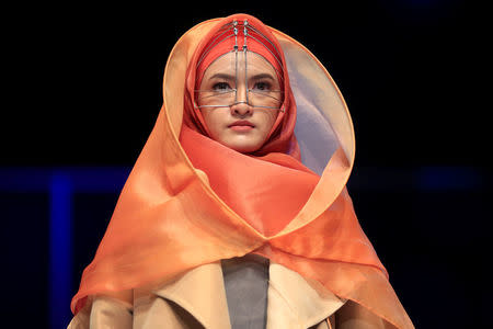 A model presents creations by student designer Sherly Az Zahra on the first day of the Indonesia Muslim Fashion Festival in Jakarta, Indonesia, April 19, 2018. REUTERS/Beawiharta