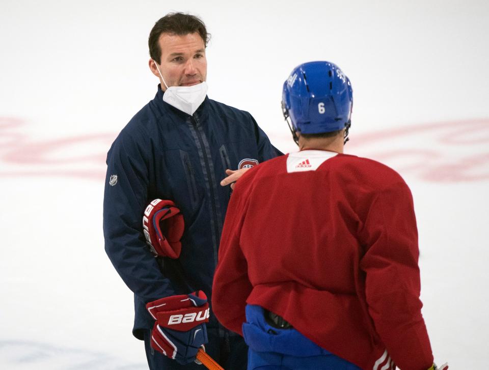 Former Montreal Canadiens interim head coach Luke Richardson, left, is pictured talking with captain Shea Weber during practice in Brossard, Quebec, on June 27, 2021. Richardson was hired to be the new Chicago Blackhawks head coach on Monday.