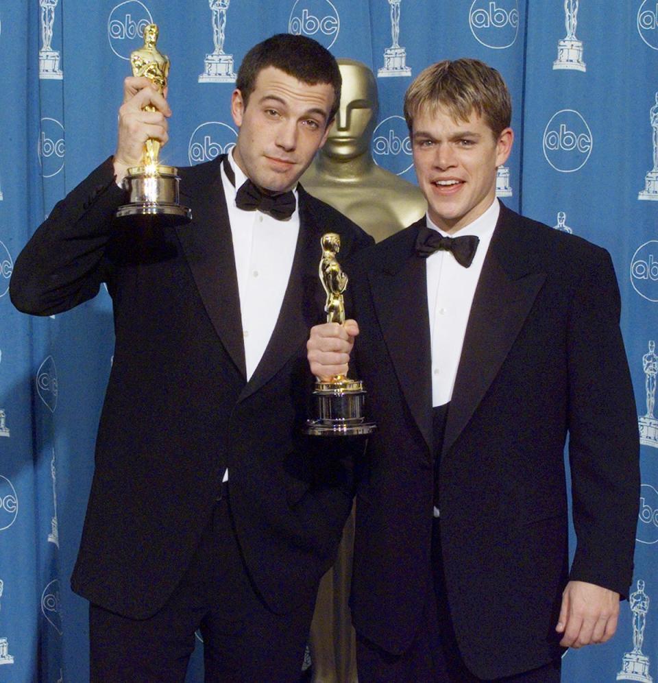 Affleck and Damon with their Oscars for Best Original Screenplay for Good Will Hunting in 1998 (AFP via Getty Images)