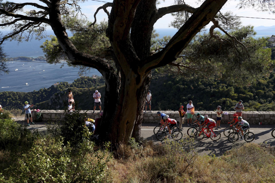 Spectators watch the riders in the Eze pass during the second stage of the Tour de France cycling race over 186 kilometers (115,6 miles) with start and finish in Nice, southern France, Sunday, Aug. 30, 2020. (AP Photo/Thibault Camus)
