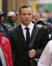 Olympic and Paralympic track star Oscar Pistorius arrives ahead of his trial for the murder of his girlfriend Reeva Steenkamp, at the North Gauteng High Court in Pretoria, March 13, 2014. Pistorius is on trial for murdering Steenkamp at his suburban Pretoria home on Valentine's Day last year. He says he mistook her for an intruder. REUTERS/Siphiwe Sibeko (SOUTH AFRICA - Tags: SPORT ATHLETICS CRIME LAW)