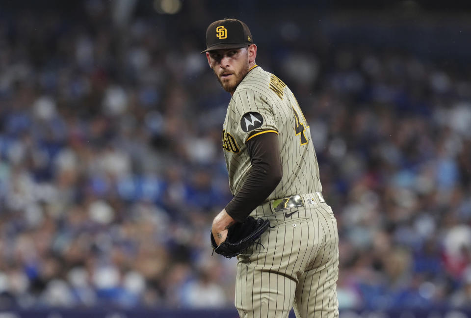 San Diego Padres starting pitcher Joe Musgrove checks on a Toronto Blue Jays runner during the fifth inning of a baseball game Tuesday, July 18, 2023, in Toronto. (Chris Young/The Canadian Press via AP)