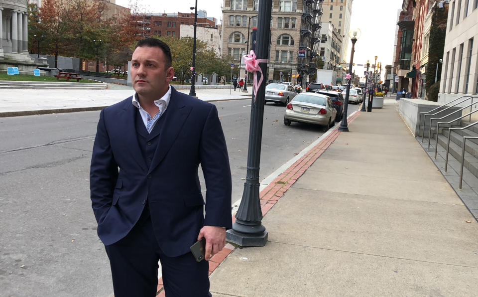 FILE - Perry Santillo walks outside the federal courthouse in Scranton, Pa., after pleading guilty to a federal fraud charge on Nov. 4, 2019. Santillo, once dubbed “King Perry”, was sentenced on Thursday, Jan. 13, 2022, to more than 17 years in prison for his role in masterminding a long-running investment scam that collected more than $115 million from 1,000 investors nationwide. (AP Photo/Michael Rubinkam. File)
