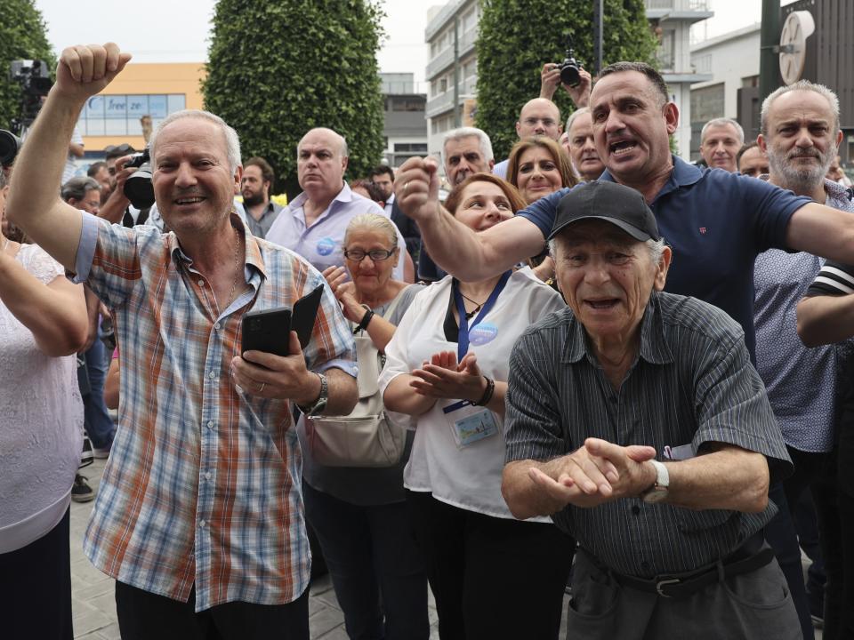 Supporters of the center-right New Democracy react as they watch the exit polls at the headquarters of the party in Athens, Greece, Sunday, June 25, 2023. Exit polls in Greek election project landslide win for conservative New Democracy party(AP Photo/Yorgos Karahalis)