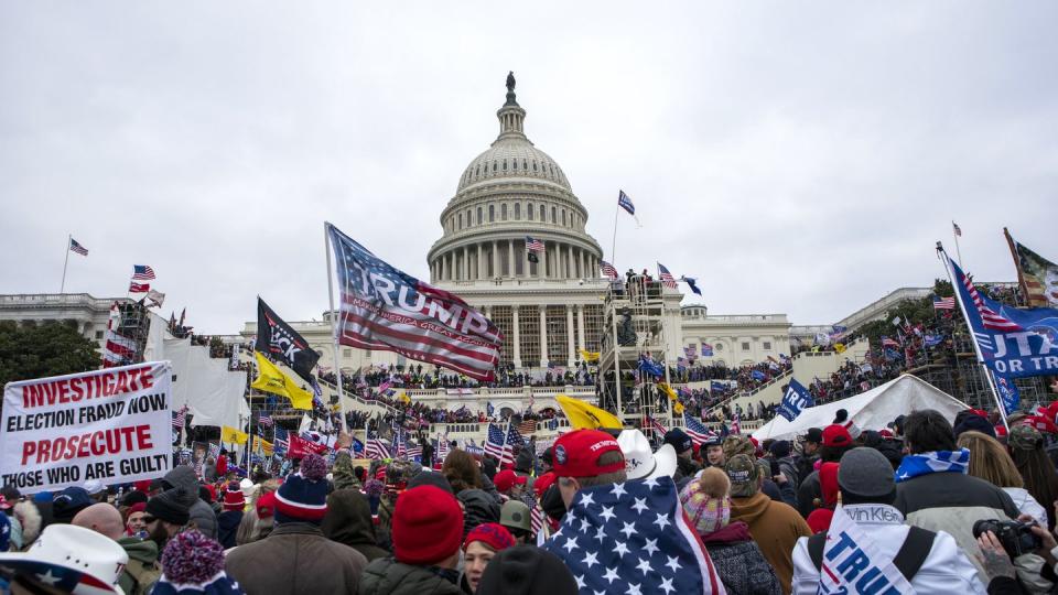 FILE - Rioters loyal to President Donald Trump rally at the U.S. Capitol in Washington on Jan. 6, 2021. (Jose Luis Magana/AP, File)