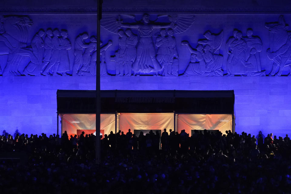 Fans watch during the first round of the NFL football draft, Thursday, April 27, 2023, in Kansas City, Mo. (AP Photo/Charlie Riedel)