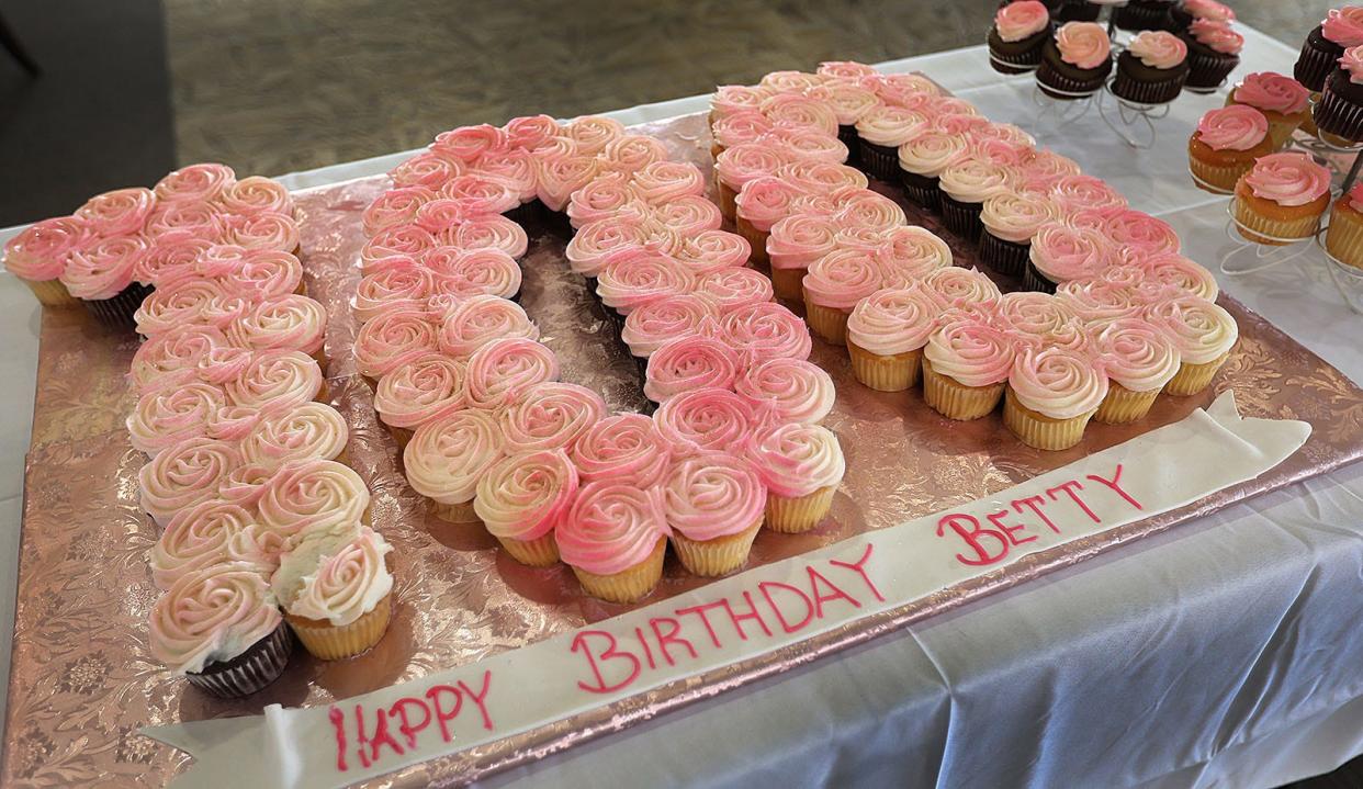 Betty Beecher celebrates her 100th birthday with cupcakes for all her friends and neighbors at Fairing Way in Weymouth on Monday, April 15, 2024.