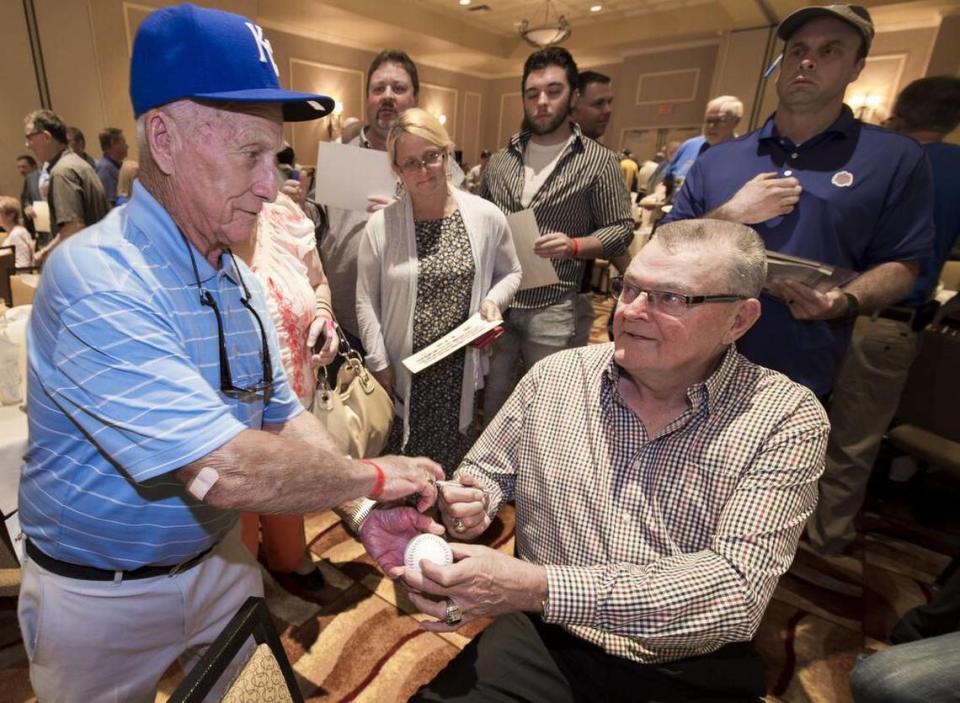Former Kansas City Royals grounds keeper George Toma (left) got a baseball signed by Don Denkinger (right), who made the infamous call in game six of the 1985 World Series that allowed the Royals to win, during the 1985 Kansas City Royals reunion at Harrah’s Casino on Thursday, August 20, 2015, in North Kansas City, Missouri. KC Star file photo
