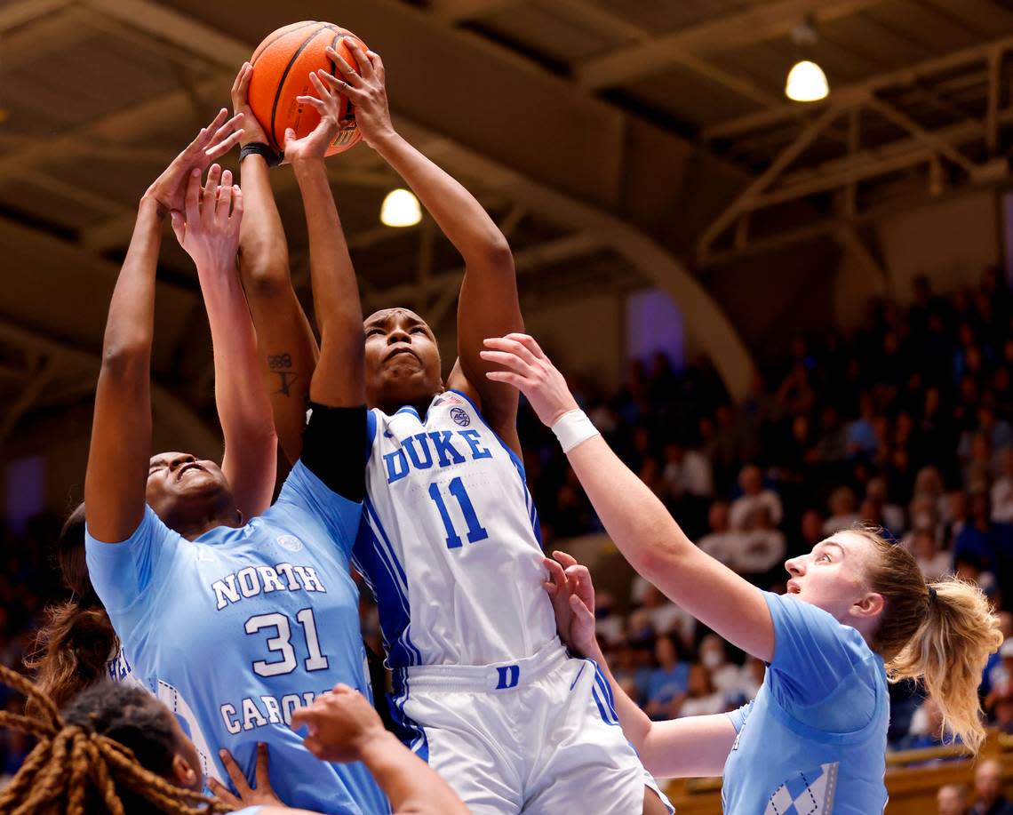 Duke’s Jordyn Oliver pulls down a rebound away from North Carolina’s Anya Poole and Alyssa Ustby during the first half of the Blue Devils’ regular season finale against North Carolina on Sunday, Feb. 26, 2023, at Cameron Indoor Stadium in Durham, N.C.