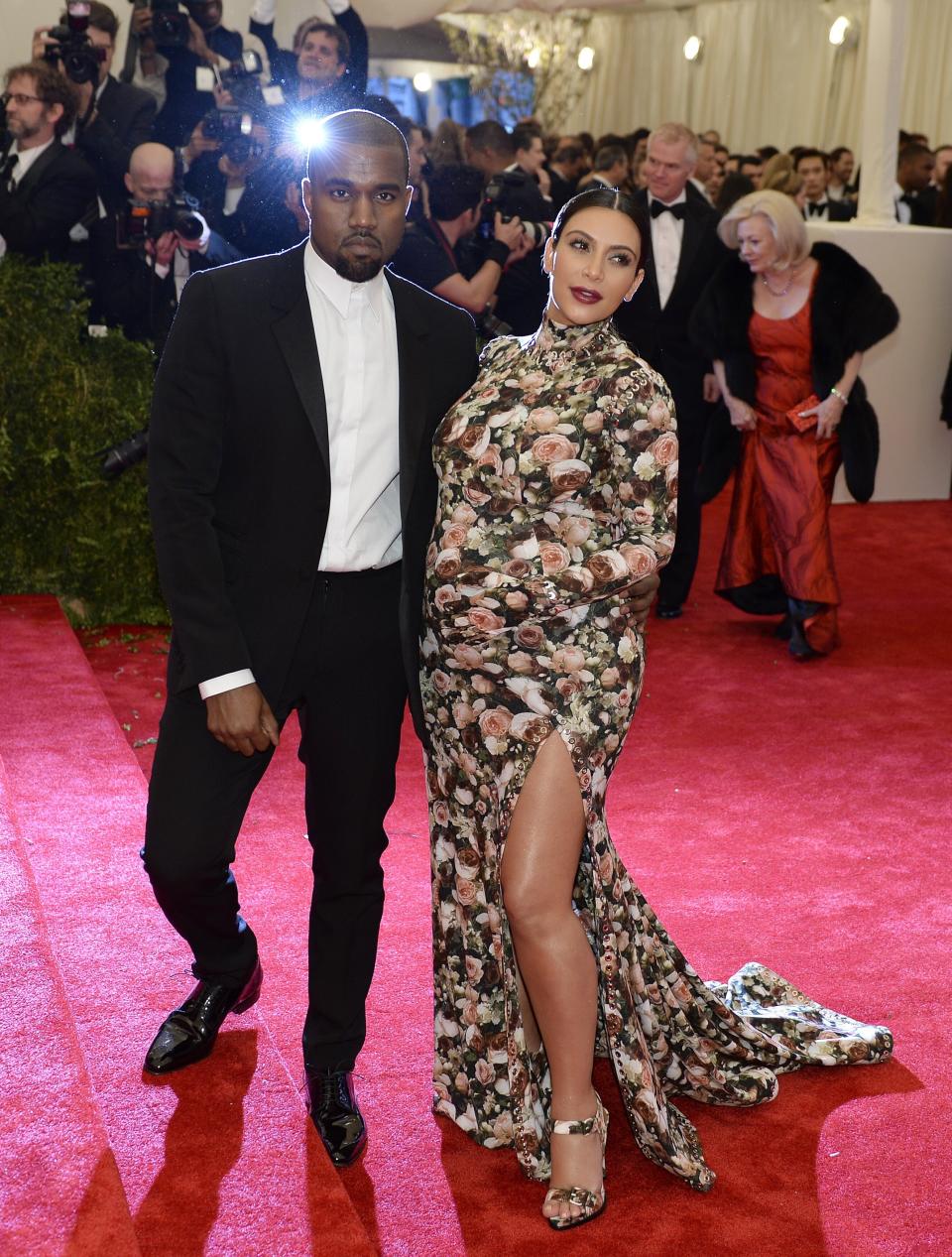 Kanye West (L) and Kim Kardashian (R) arrive at the Metropolitan Museum of Art's Costume Institute Gala benefit in honor of the museum’s latest exhibit, “Punk: Chaos to Couture.” May 6, 2013 in New York. AFP PHOTO/Timothy A. CLARY (Photo credit should read TIMOTHY A. CLARY/AFP/Getty Images)