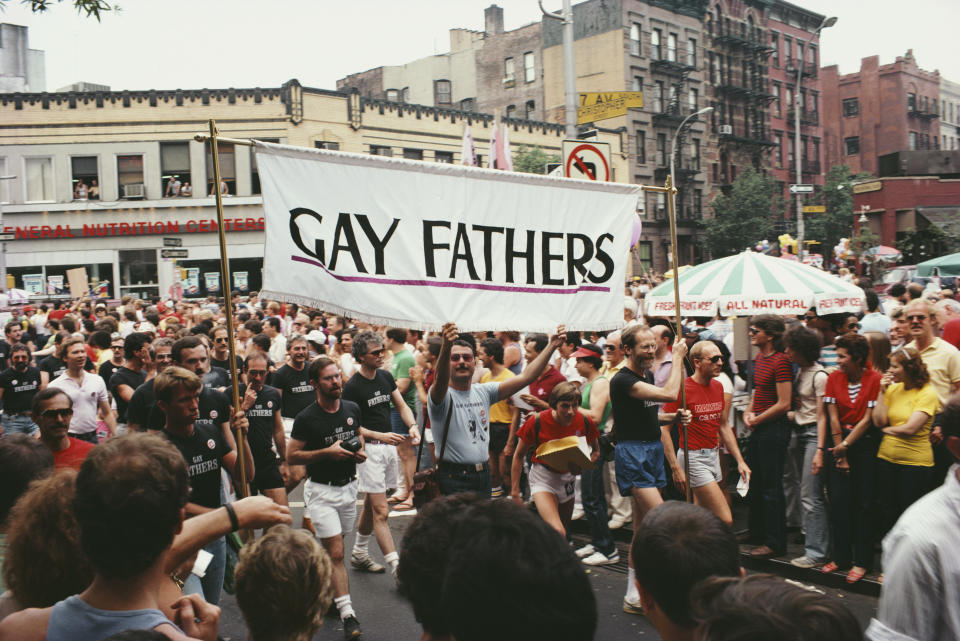 Gay Fathers take part in a gay Pride parade on the corner of Christopher Street and Seventh Avenue S in New York City, June 1982.