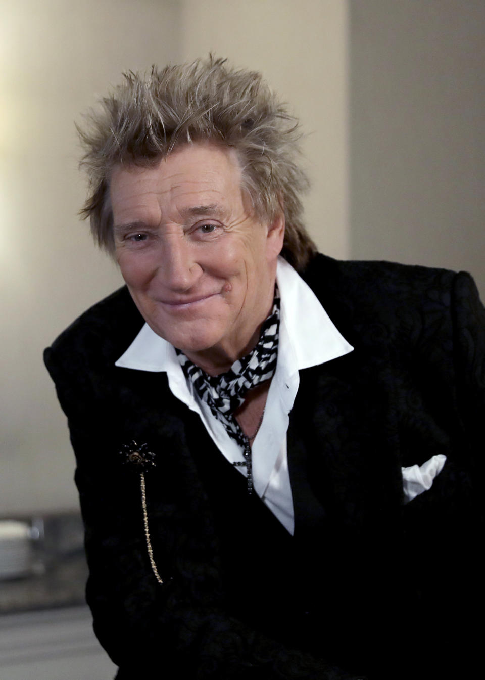 In this photo taken on Thursday, Nov. 14, 2019, British singer Rod Stewart poses for the media after an interview with The Associated Press at a hotel in London. Stewart, known for decades as a consummate crooner, rocker, fashion plate and tongue-in-cheek sex symbol, is adding a new element to his image: serious model railroad builder. The one time front man of The Faces who has hits dating back to the 1960s has put the finishing touch on a 23-year project that has landed him on the cover of Railway Modeller magazine, a far cry from Rolling Stone, whose cover he has graced many times. (AP Photo/Matt Dunham)